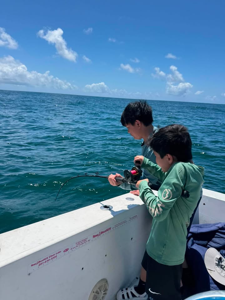 Kids fishing offshore
